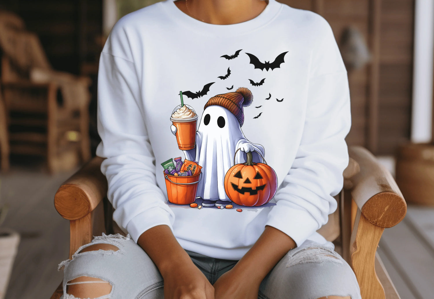 Cute Halloween ghost design with a pumpkin and treats, perfect for a spooky season sweater.