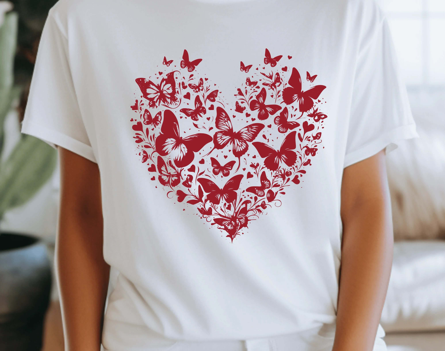 Red butterfly heart design on a white shirt perfect for Valentines Day celebrations.