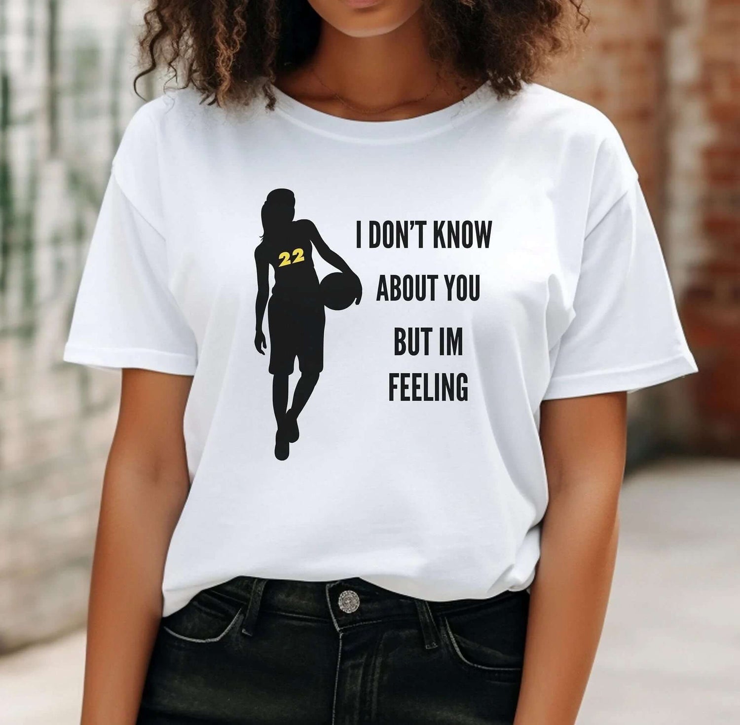 Womens Sports graphic tee featuring a basketball player silhouette and motivational text.
