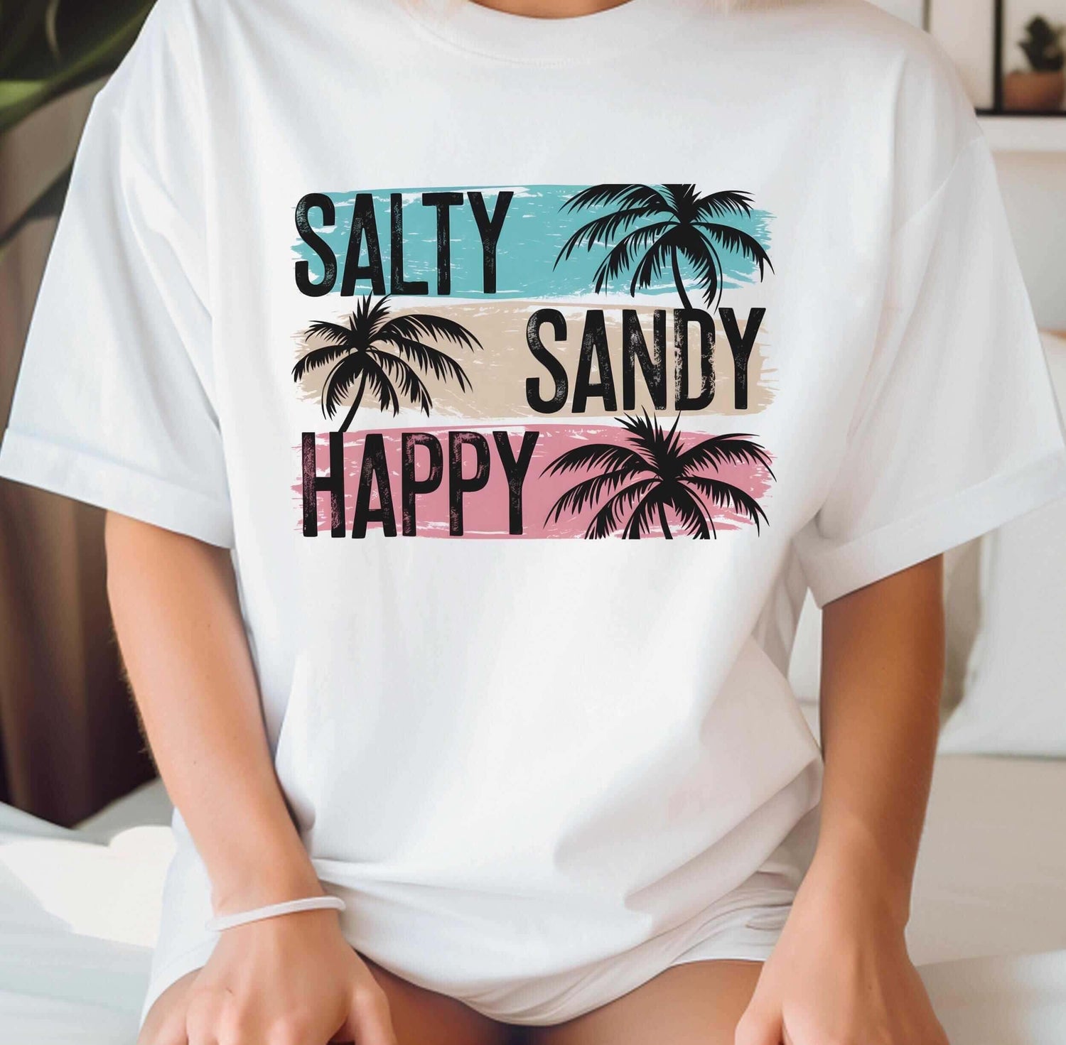 Summer themed white t-shirt featuring 'Salty Sandy Happy' with palm tree graphics.