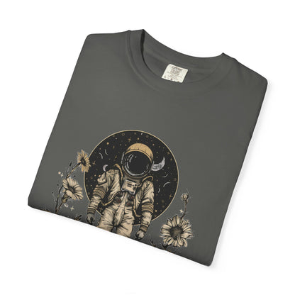 Astronaut Shirt, Boho Astronaut Shirt, Vintage Boho Womens Space Shirt folded t-shirt with astronaut design and flowers.