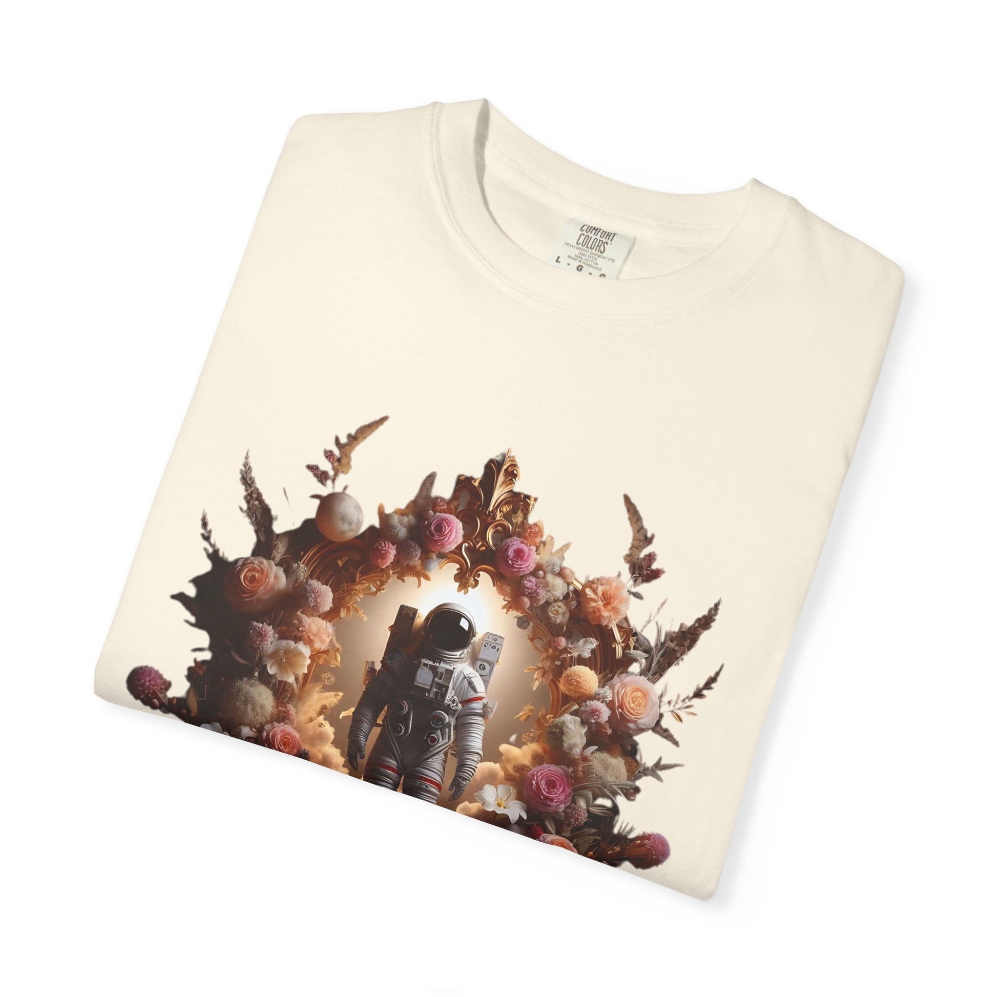 Boho astronaut t-shirt featuring a floral design and vintage astronaut graphic on an off-white background.