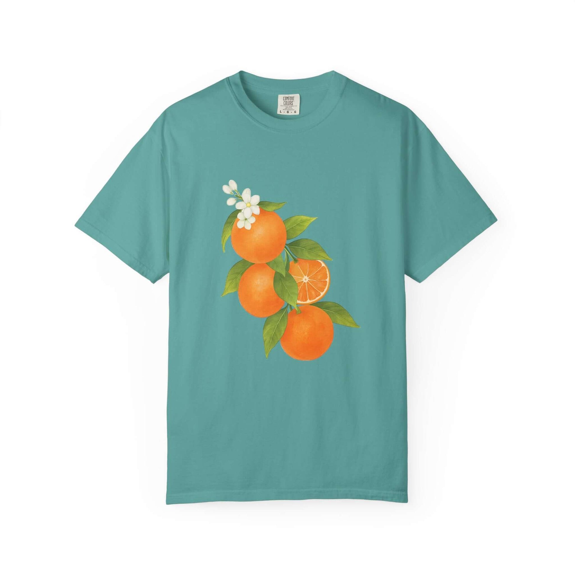 Vintage Orange Shirt, Art Graphic Fruit Shirt featuring a vibrant orange fruit design on a teal background.