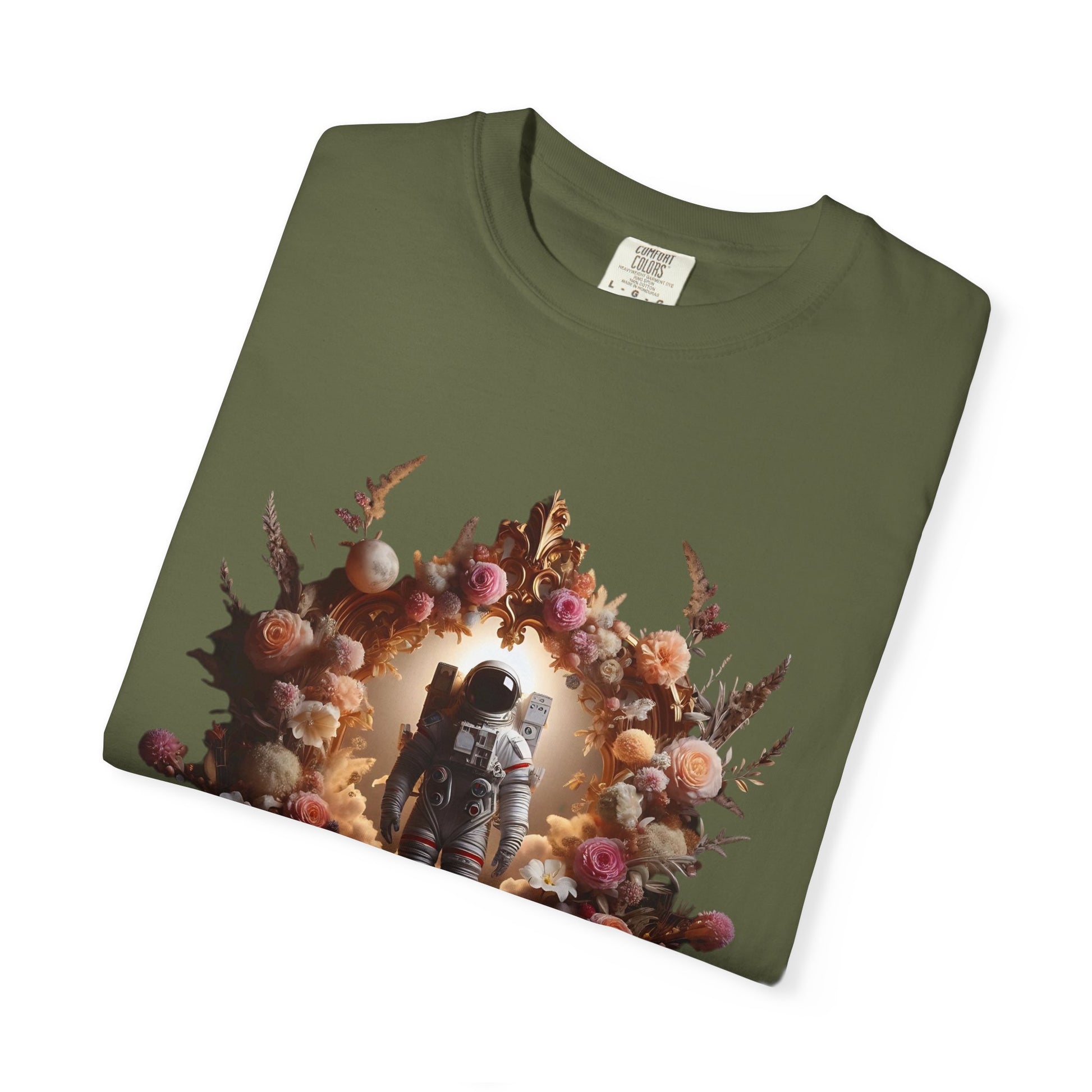 boho astronaut t-shirt featuring astronaut surrounded by flowers on olive green shirt background.