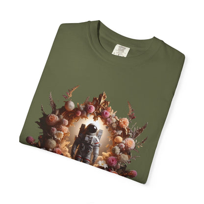 boho astronaut t-shirt featuring astronaut surrounded by flowers on olive green shirt background.