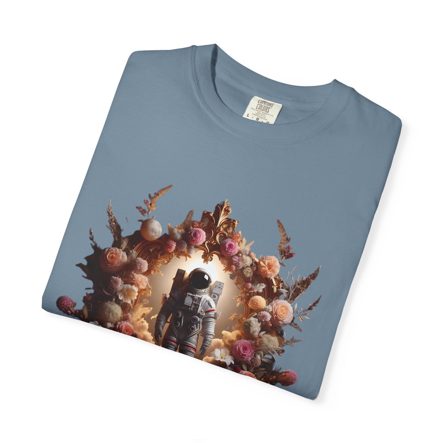 boho astronaut t-shirt featuring an astronaut surrounded by floral designs on a blue background.