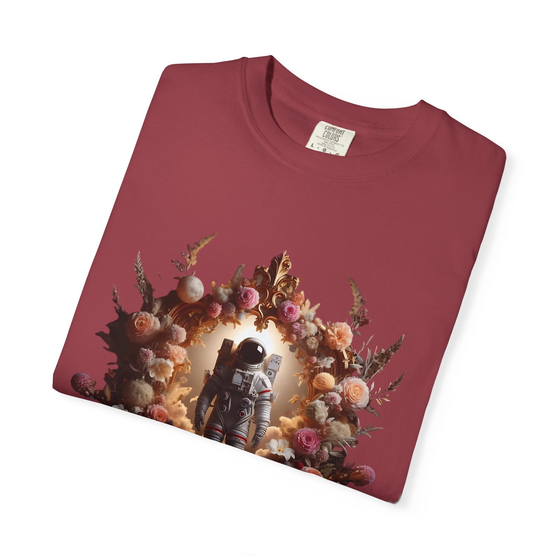 boho astronaut t-shirt featuring an astronaut surrounded by floral designs on a burgundy shirt.