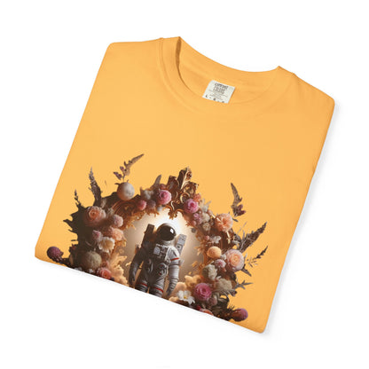 Boho astronaut t-shirt with astronaut graphic and floral design on a yellow shirt background.